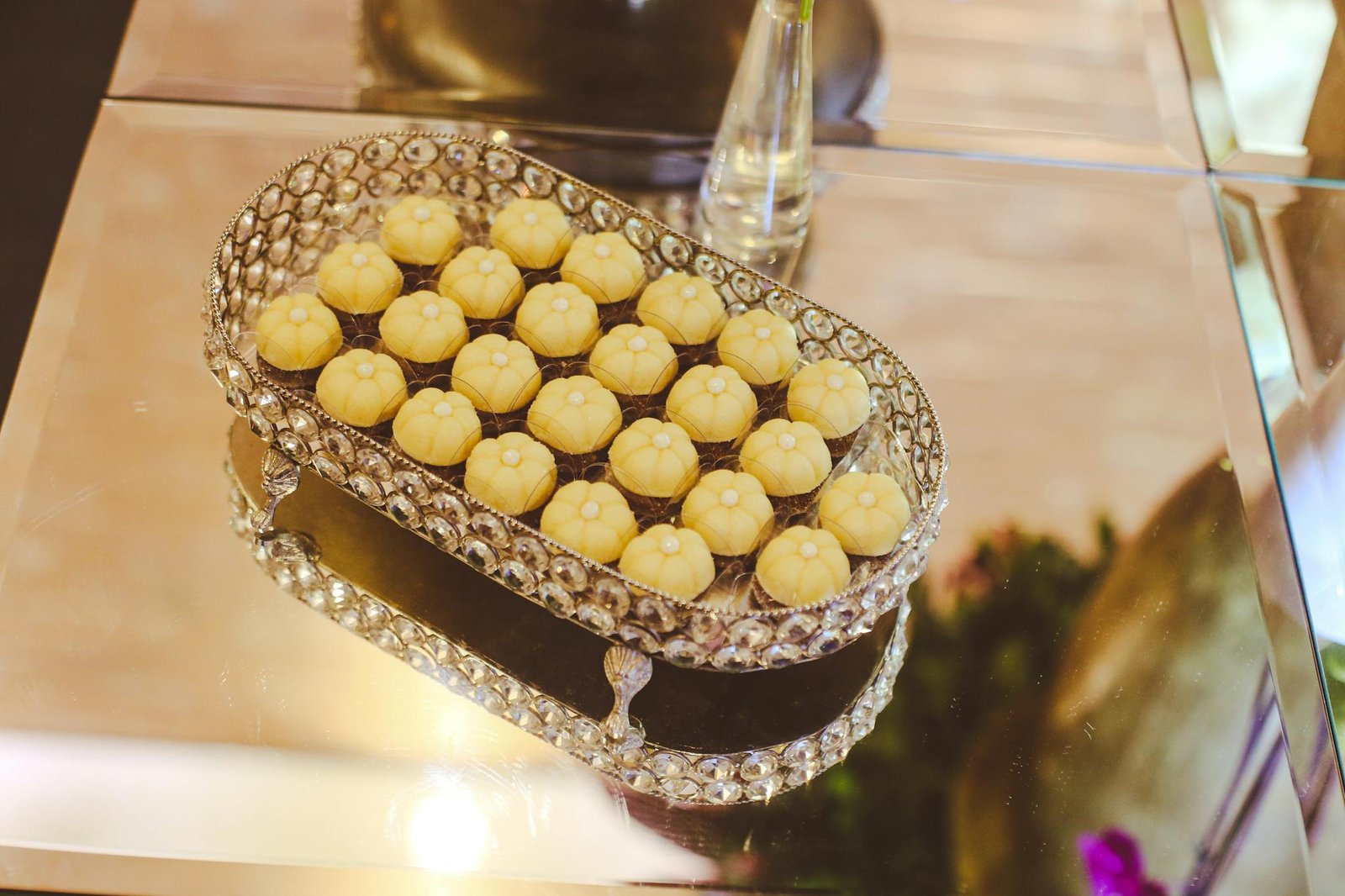 Fancy sweets elegantly displayed on a crystal tray, perfect for upscale events or dessert showcases.